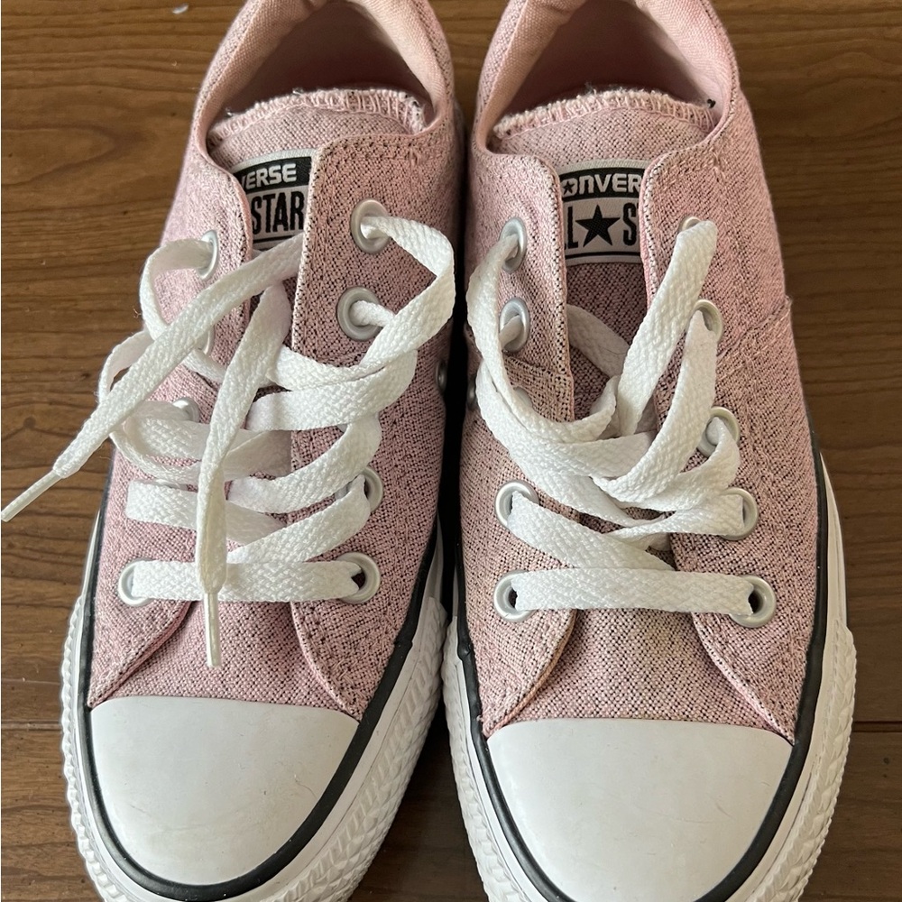 Pink and black Converse sneakers